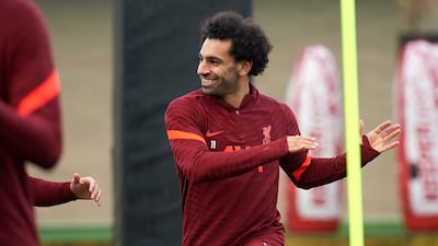 Liverpool star Mohamed Salah smiles during a training session at AXA Training Centre in Kirkby, England.