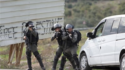 Israeli security forces take position during clashes with Palestinians near the West Bank city of Nablus. AP