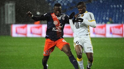 Lille's midfielder Ibrahim Amadou (R) challenges Montpellier's forward Casimir Ninga (L) during the French L1 football match between Montpellier and Lille at the Mosson stadium in Montpellier, southern France, on February 27, 2016. AFP