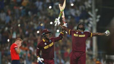 West Indies Carlos Brathwaite, right, and Marlon Samuels celebrate after winning the final. REUTERS/Adnan Abidi