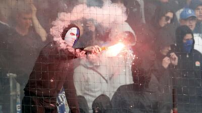 A Hamburg fan lights fireworks when his team relegates for the first time in Geran Bundesliga history during the German Bundesliga soccer match between Hamburger SV and VfL Borussia Moenchengladbach in Hamburg, Germany, on May 12, 2018. Michael Sohn / AP Photo