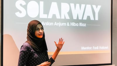 The Masdar Institute team presents their project SolarWay. Courtesy APCO Worldwide