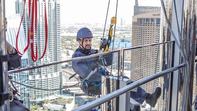 Hammond prepares to clean the exterior of Burj Khalifa.