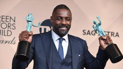 Idris Elba with his two SAG Awards. Jordan Strauss / Invision / AP