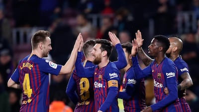 Barcelona's Ousame Dembele, right, and Lionel Messi, centre, both scored for Barcelona in their victory against Levante. AP Photo