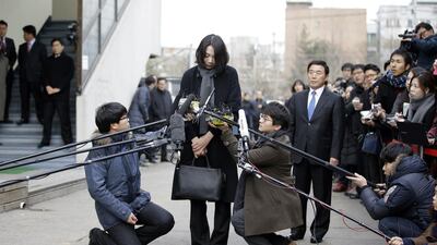 Cho Hyun-ah, who was head of cabin service at Korean Air and the eldest child of Korean Air chairman Cho Yang-ho, speaks to the media upon her arrival for questioning by authorities for delaying a flight in an incident now dubbed ‘nut rage’. Lee Jin-man / AP Photo