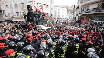 Demonstrators hold Jordanian national flag and chant slogans during a protest against a government's agreement to import natural gas from Israel, in Amman, Jordan. Reuters