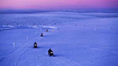 Snowmobile safari at Kakslauttanen Arctic Resort. Valtteri Hirvonen / Kakslauttanen Arctic Resort