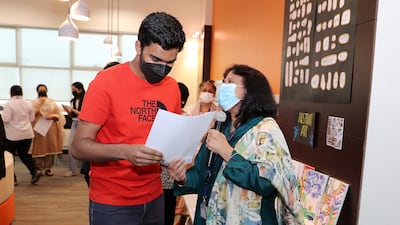 Manav Sankaran receives his IB results from Sunipa Neogi, IB co-ordinator at Gems Modern Academy.