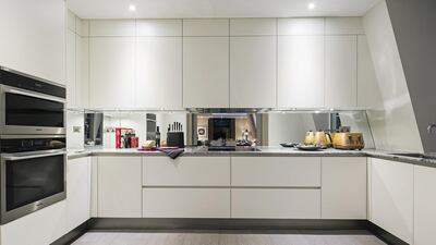 There's a Hacker kitchen with marble work surfaces and Miele appliances. Courtesy Oakmayne Bespoke
