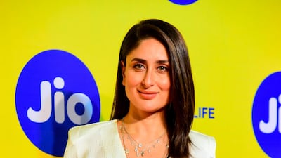 The design combines a high waist trouser with a textured silk top half.