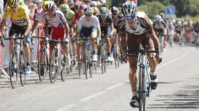Stage winner Alexis Vuillermoz of France, right, breaks away from the pack with Britain's Christopher Froome, wearing the overall leader's yellow jersey, in the final climb towards the finish line in the eighth stage of the Tour de France cycling race over 181.5 kilometers (112.8 miles) with start in Rennes and finish in Mur-de-Bretagne, France, Saturday, July 11, 2015. (AP Photo/Laurent Cipriani)