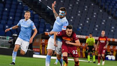 Lazio's Serbian midfielder Sergej Milinkovic-Savic tackles Roma's Italian forward Stephan El Shaarawy. AFP