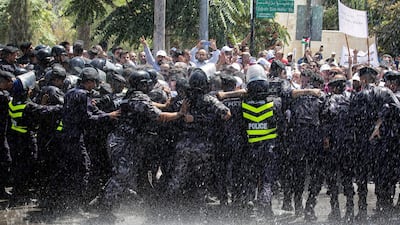 Jordanian teachers clash with security forces during a protest in the capital Amman earlier in September. AFP