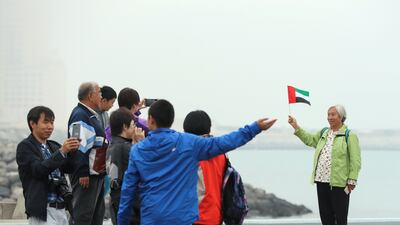 Chinese tourists from Beijing enjoy the Abu Dhabi winter weather in 2018. Victor Besa / The National