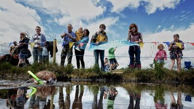 Laura Sherwin takes part in the Irish Bog Snorkelling championship at Peatlands Park on Sunday in Dungannon, Northern Ireland. Charles McQuillan / Getty Images