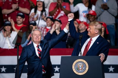 Lindsey Graham joins President Trump during a 2020 campaign rally. EPA