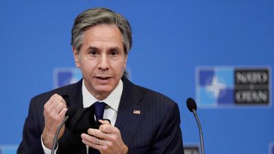 US Secretary of State Antony Blinken removes his mask as gives a press briefing at the end of a NATO Foreign Ministers' meeting. Reuters