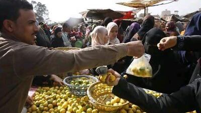 Egyptians rush to buy produce from a Cairo street market as supplies of fresh fruits and vegetables are under pressure.