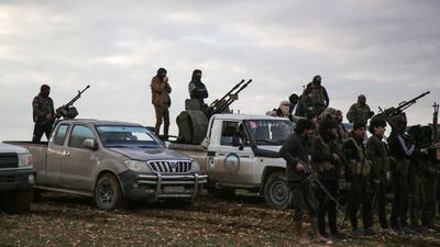 Turkish-backed Syrian fighters gather with their vehicles at a position near the northern Syrian town of Manbij on December 28, 2018.AFP