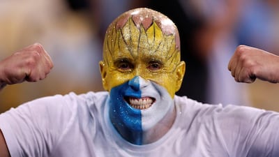 A Uruguayan fan cheers for his team. EPA