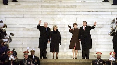 President-elect George W. Bush and his wife Laura Bush with Vice-President-elect Dick Cheney and his wife Lynn wave at the Lincoln Memorial at the opening ceremonies of the inauguration in Washington January 18, 2001. Reuters