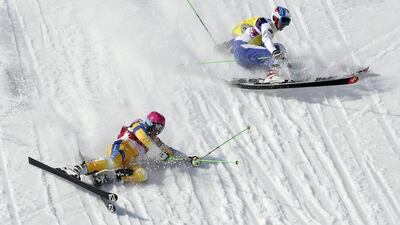 Sweden's Victor Oehling Norberg, left, and Russia's Igor Korotkov crash during a men's ski cross heat at the Rosa Khutor Extreme Park,on Feb. 20, 2014, in Krasnaya Polyana, Russia. Andy Wong / AP Photo