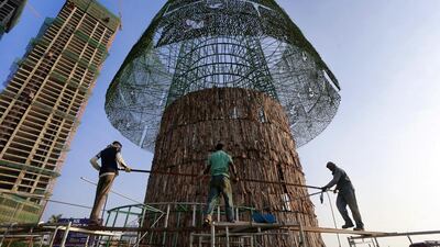 But twice the construction deadline was missed, and now organizers hope to erect the tree on Christmas Eve. Eranga Jayawardena/AP Photo