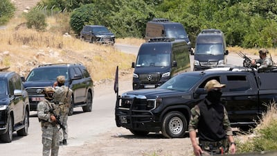 Forces of the regional Kurdish administration secure the area of the Jasana Cave ahead of a symbolic disarmament ceremony by the separatist PKK group as part of the peace process with Turkey, in Sulaymaniyah governorate, Iraq. AP