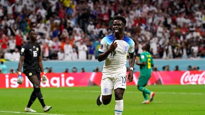 England's Bukayo Saka celebrates scoring the third goal. PA