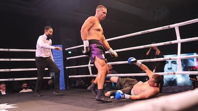 Jamie King floors Medhat El Housny during their fight on the Hafthor Bjornsson-Simon Vallily undercard. EPA