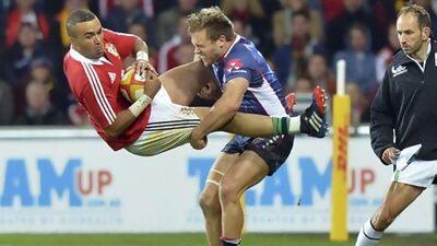 Lachlan Mitchell, right, of the Melbourne Rebels, will miss one match for his uneccessarily rough hit on British & Irish Lions winger Simon Zebo.