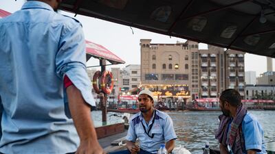 Abra captains prepare to break their fast on Dubai Creek during Ramadan. All photos: Antonie Robertson / The National