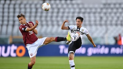 Simone Edera (L) of Torino FC clashes with Matteo Scozzarella of Parma. Getty Images
