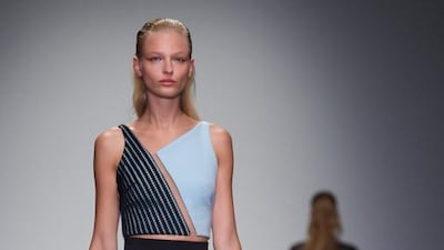 Diagonals (David Koma): With pattern very much taking a back seat and tailoring simplified, it took a little extra effort to dress the body flatteringly, but there’s nothing like a diagonal line to add dynamic movement to an outfit, slenderise a torso and add a certain sense of caution-to-the-wind fashion savvy. Preen by Thornton Bregazzi, Marios Schwab and Lucas Nascimento all made use of the optical illusion offered by this trend, but it was in the young Brit David Koma’s collection that it was particularly striking. Previously known for his intricate, perfectly symmetrical frocks in the vein of Alexander McQueen, Koma took to diagonal prints and cuts with gusto, in clean monochrome dresses, tops and skirts sliced and wrapped to zig-zag across the body. Andrew Cowie / EPA