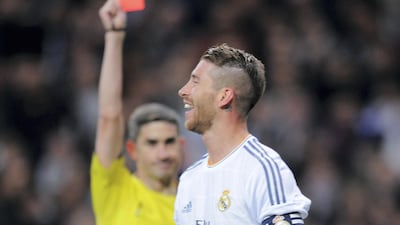 Sergio Ramos of Real Madrid is shown a red card by referee Alberto Undiano Mallenco during a La Liga match against Barcelona in 2014.