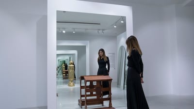 Three of the four mirrors include an object that represents each religion