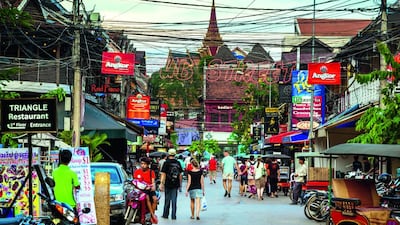 The busy streets of Siem Reap are easily navigated by foot, although tuk-tuks and taxis can be hailed for longer journeys. Alexander Burzik / iStockphoto.com