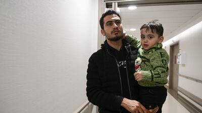 Beshar Al Andik, Sham's brother-in-law, with son Ibrahim, speaks to The National at the hospital. Khushnum Bhandari / The National