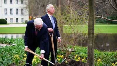 King Charles and Mr Steinmeier plant a tree after attending a Green Energy reception at Bellevue Palace, Berlin. PA