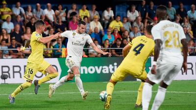 Real Madrid's Welsh forward Gareth Bale (2L) scores a goal during the Spanish league football match Villarreal CF against Real Madrid CF at La Ceramica stadium in Vila-real. AFP