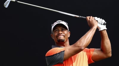 Tiger Woods during the third round of the Dubai Desert Classic on Saturday. Woods shot a 2-under 70 for the day, leaving him 5-under overall. Karim Sahib / AFP