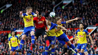 Manchester United's Chris Smalling in action with Ward-Prowse, Romeu and Jannik Vestergaard. Reuters