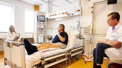 Netherlands' Queen Maxima speaks with a patient during a visit to The University Medical Centre in Utrecht, where she talked with patients and staff about treatments that were postponed due to the ongoing coronavirus pandemic. AFP