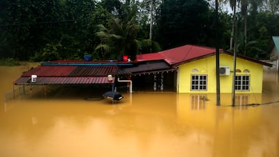 A flooded house after continuous rainfall in Segamat, in Malaysia. EPA