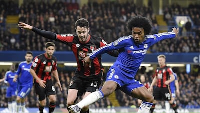 Chelsea’s Willian (R) in action against AFC Bournemouth’s Adam Smith (L) during the English Premier League soccer match between Chelsea and AFC Bournemouth at Stamford Bridge in London, Britain, 05 December 2015. EPA/FACUNDO ARRIZABALAGA