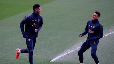 United's Jesse Lingard, left, and Marcus Rashford enjoy a lighter moment in training. AFP