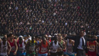 North Korean spectators watch from the stands of Kim Il Sung Stadium as runners line up a the start of the Mangyongdae Prize International Marathon in Pyongyang, North Korea. The annual race, which includes a full marathon, a half marathon, and a 10-kilometer run, was open to foreign tourists for the first time this year. David Guttenfelder / AP