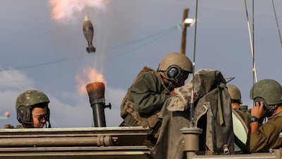 Israeli soldiers fire mortar shells near their border with Gaza on Wednesday. Reuters