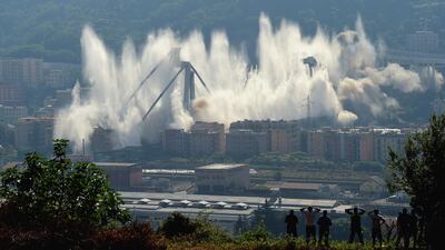 The pylons 10 and 11 of the collapsed Morandi viaduct are demolished with a controlled dynamite explosion. Getty
